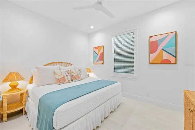 a living room with furniture and painting on the wall