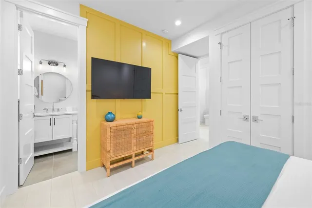 a bathroom with a granite countertop toilet a sink and a mirror