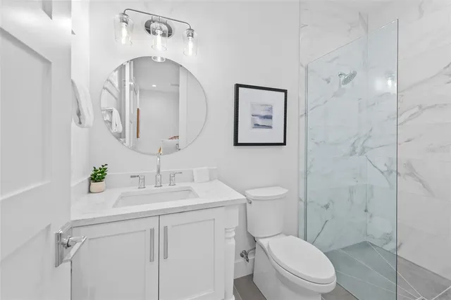 a bathroom with a shower and a sink