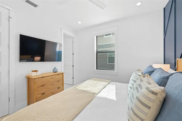 a bed room with a bed and a television