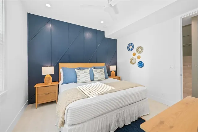 a bed room with a bed and a television