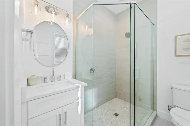 a bedroom with a bed and a flat tv screen