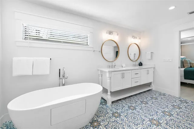 a view of a swimming pool with potted plants