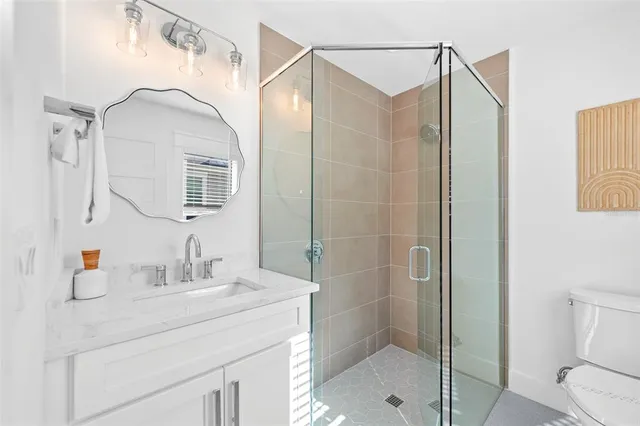 an aerial view of a city with ocean view