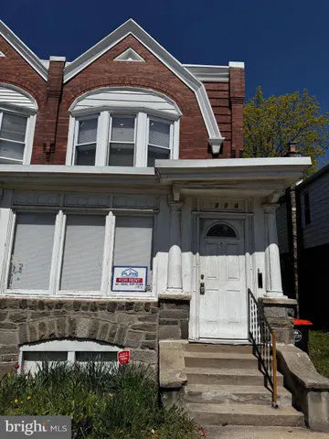 a front view of a building with many windows