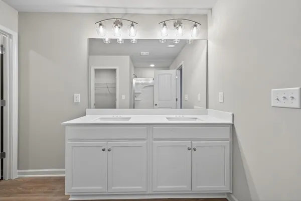 a bathroom with a glass shower door