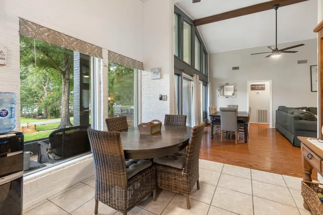 a view of a dining room with furniture window and outside view