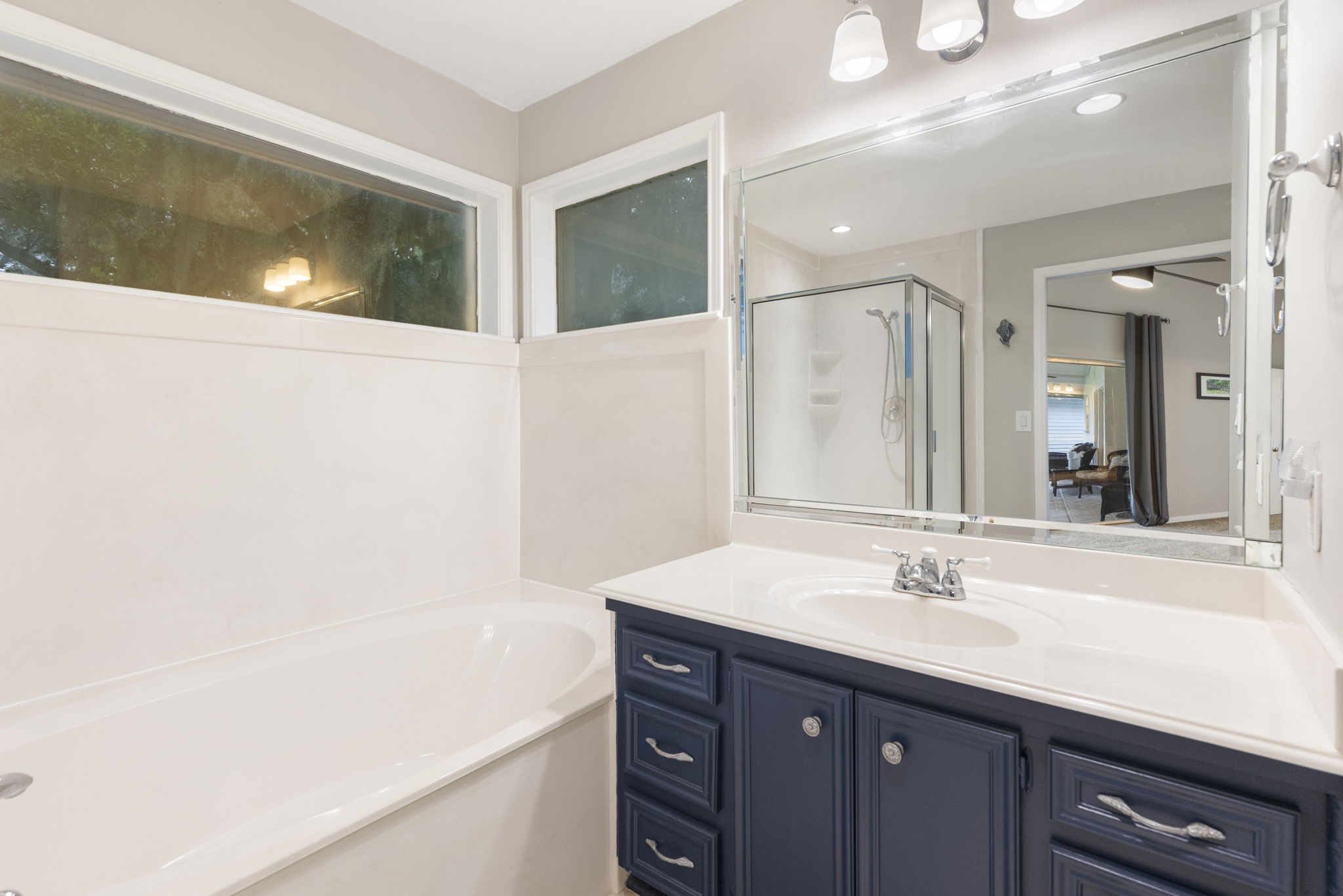 245 Lakeland Road Huntsville, TX 77320 - Photo 23 of 49 a bathroom with a sink and a mirror
