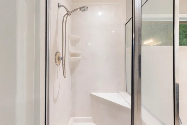 a bathroom with a shower and a sink