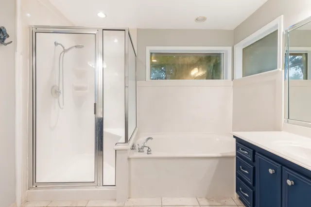 a bathroom with a bathtub and a sink