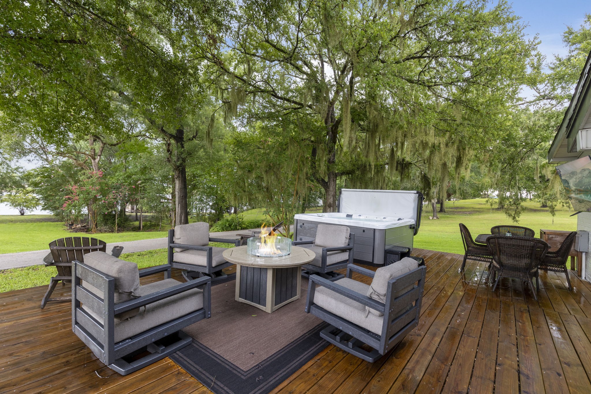 245 Lakeland Road Huntsville, TX 77320 - Photo 37 of 49 an outdoor sitting area with furniture and wooden floor