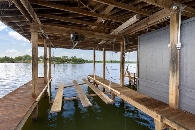 a view of a balcony with chair and wooden floor
