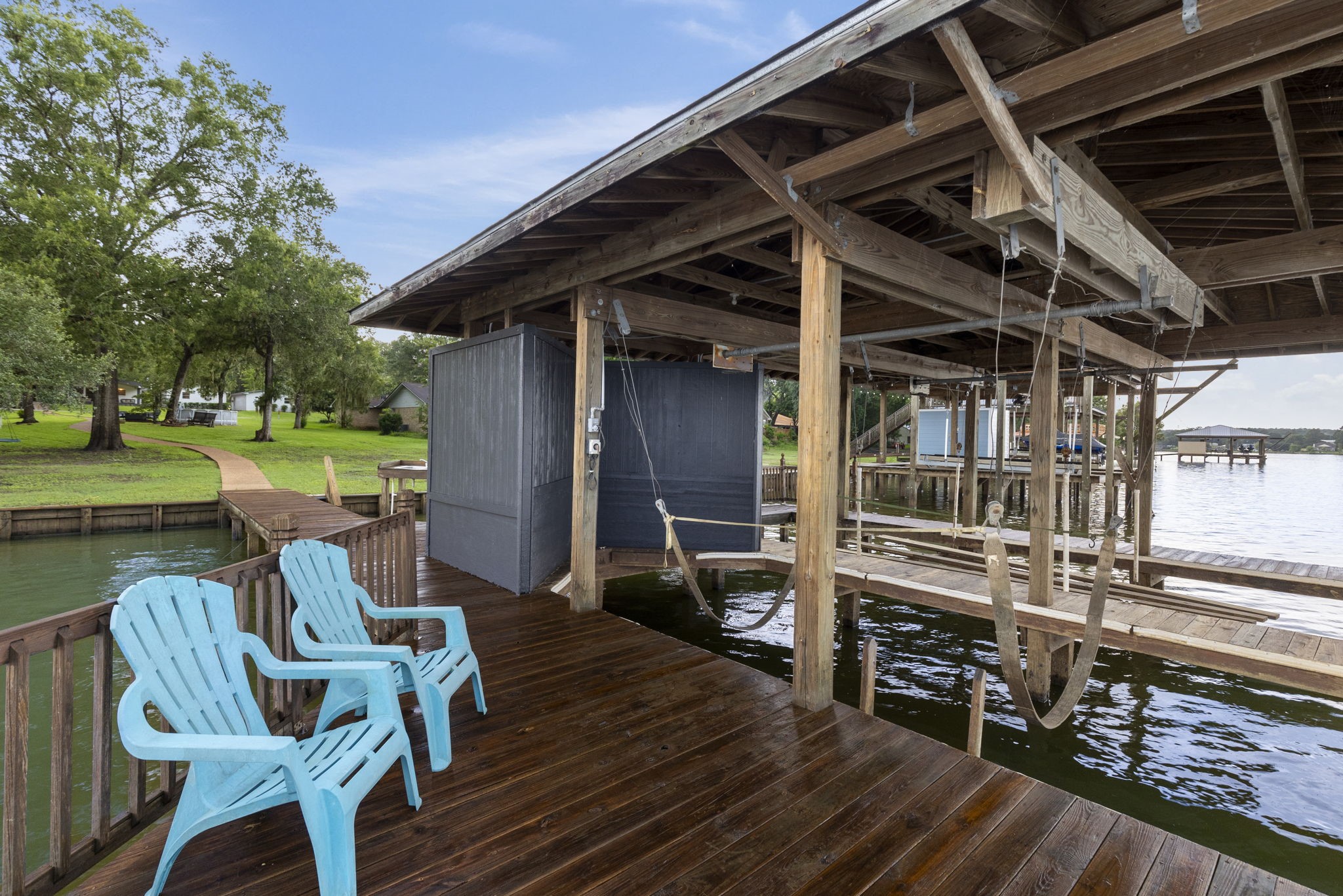 245 Lakeland Road Huntsville, TX 77320 - Photo 48 of 49 a view of a chairs and table on the wooden deck