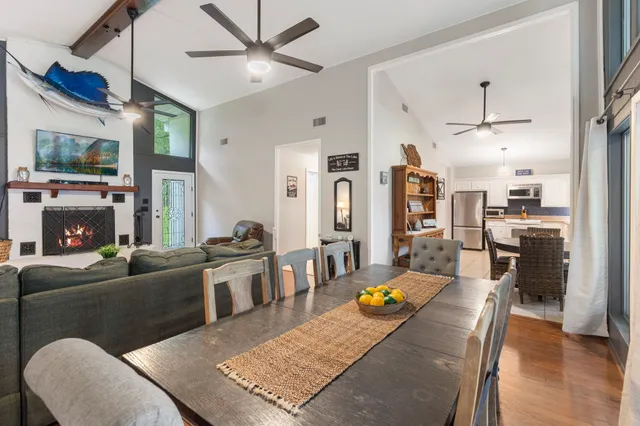 a living room with fireplace furniture and a flat screen tv