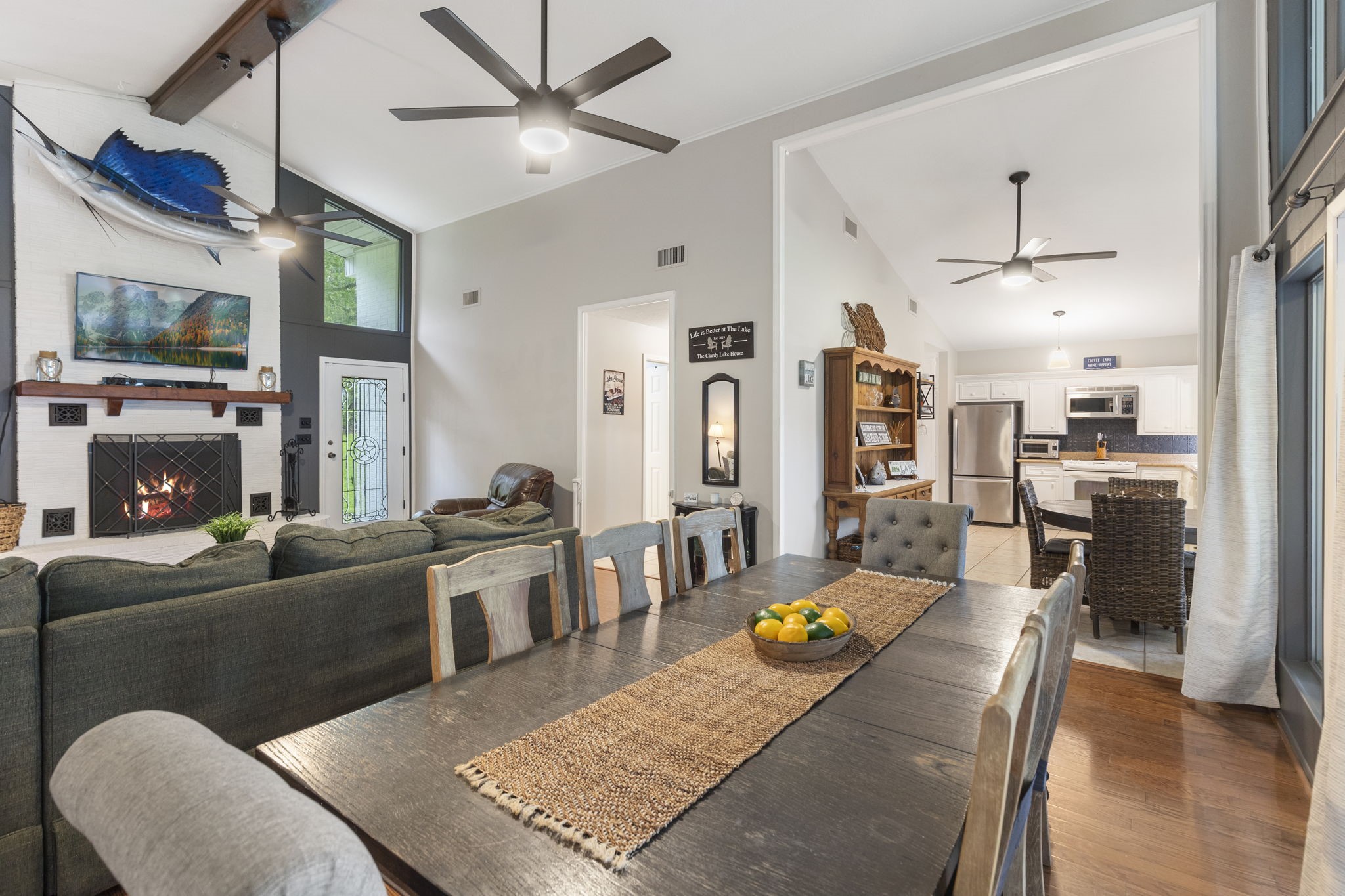 245 Lakeland Road Huntsville, TX 77320 - Photo 9 of 49 a living room with fireplace furniture and a flat screen tv