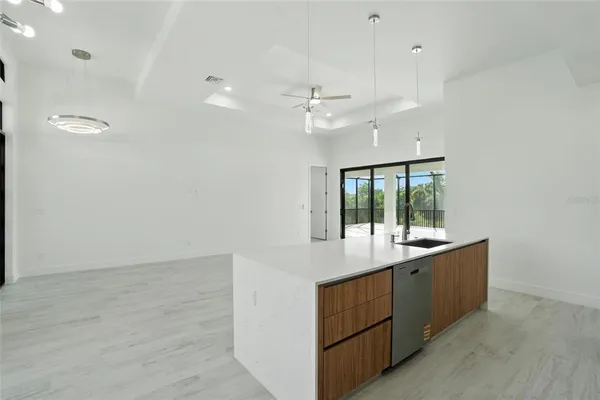 a kitchen with stainless steel appliances granite countertop a stove a microwave and a refrigerator
