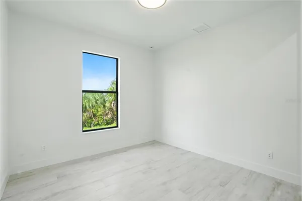 a view of balcony with a floor to ceiling window and wooden floor