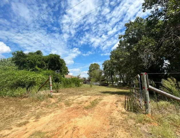 a view of swimming pool with a yard