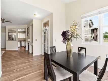 a view of a dining room with furniture and wooden floor