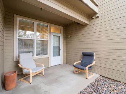 a outdoor space with a couch and a potted plant