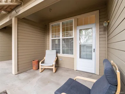 a chair and table in front of a window