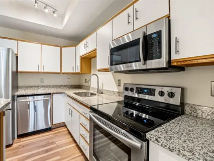 a kitchen with a stove and a microwave