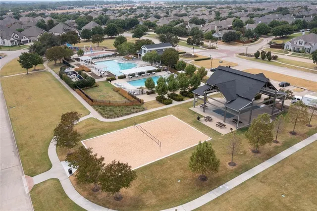 an aerial view of a house with a swimming pool