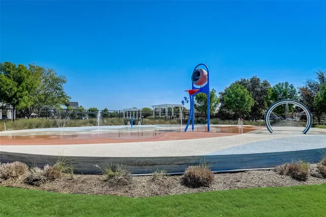 a view of a lake with a yard