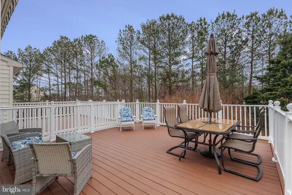 a view of a chairs and table on the deck