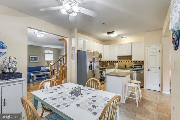 a kitchen with a refrigerator sink and microwave
