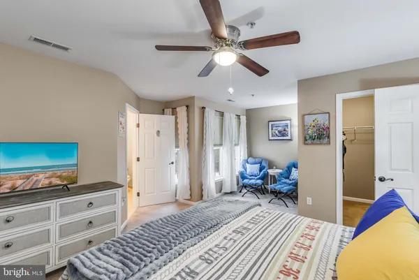 a bedroom with a bed and furniture