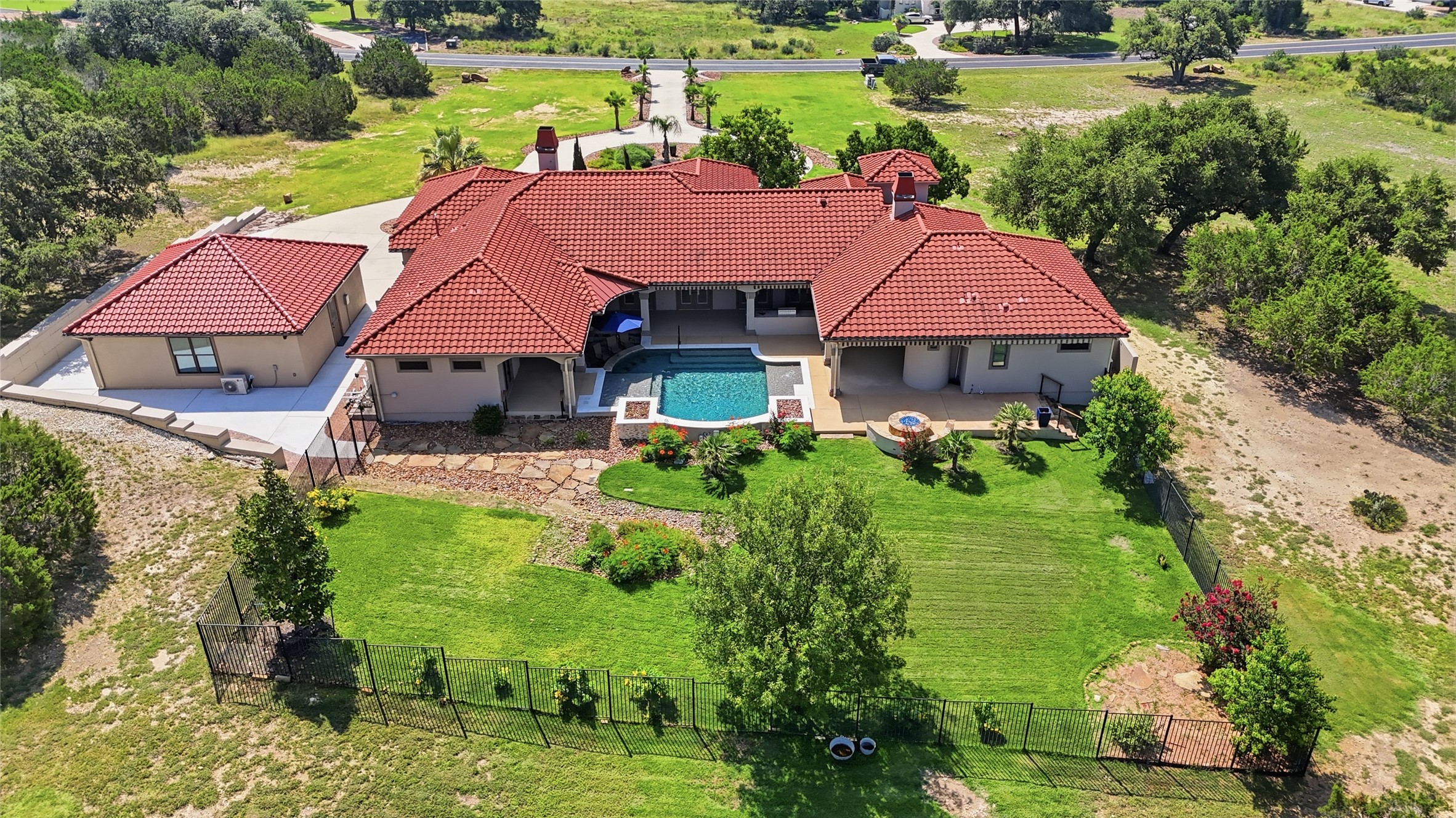 228 Puzzle Pass Spring Branch, TX 78070 - Photo 10 of 35 The backyard is an oasis! Fully fenced and landscaped with 1300SF of covered patio space.