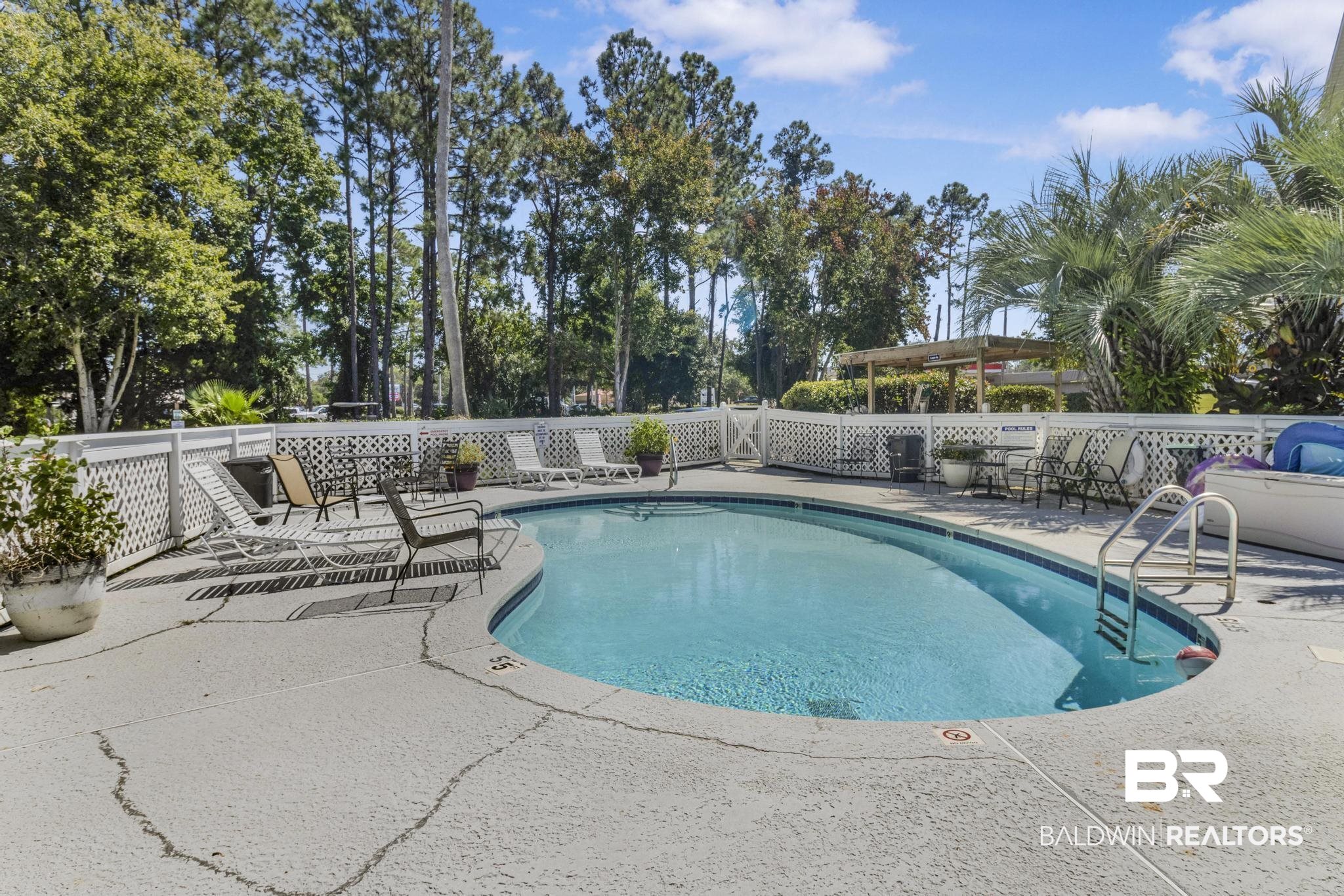 25957 Canal Road, Unit 306 Orange Beach, AL 36561 - Photo 24 of 28 View of pool with a patio