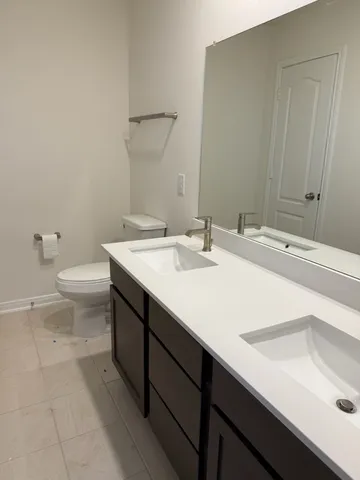 a bathroom with a sink and a toilet