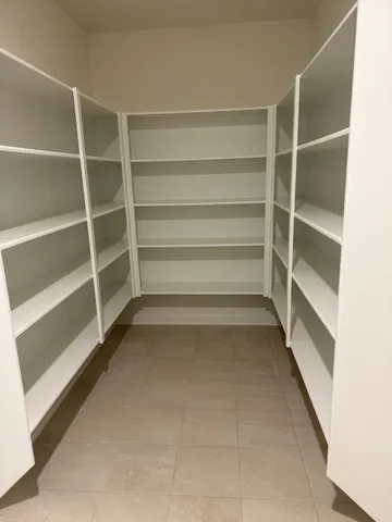 a view of an empty walk in closet