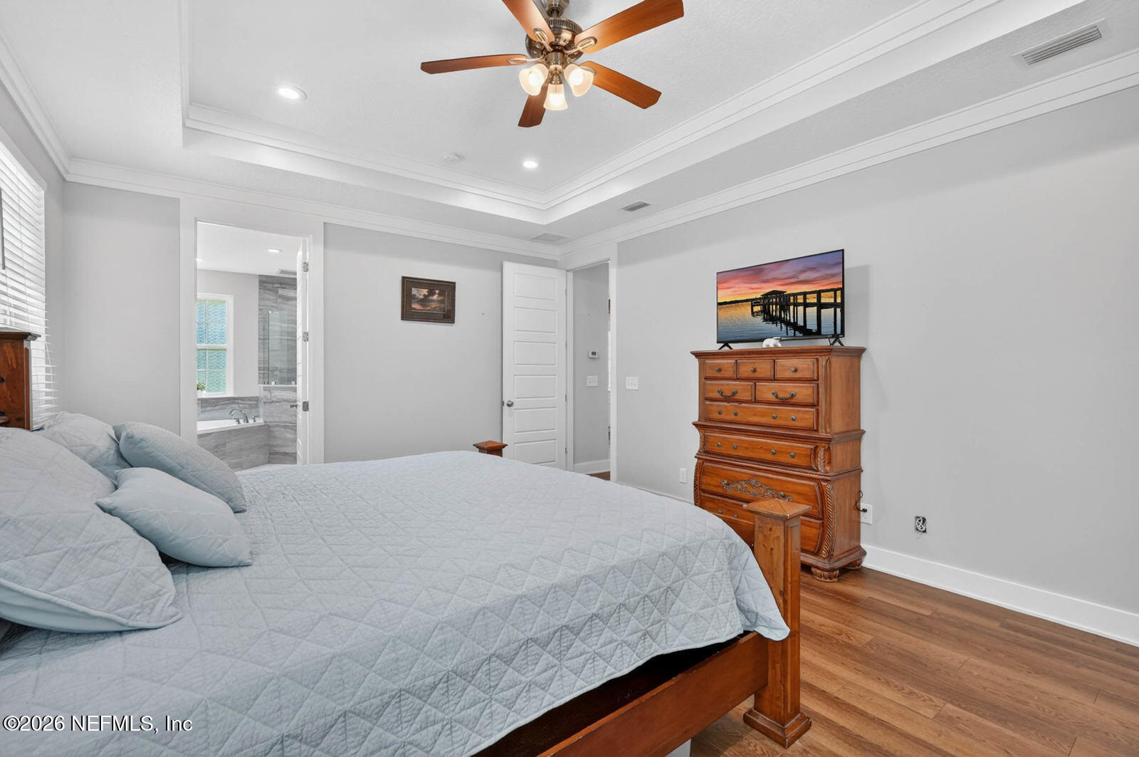 264 Peniel Church Road Palatka, FL 32177 - Photo 19 of 48 a bedroom with a bed and a chandelier