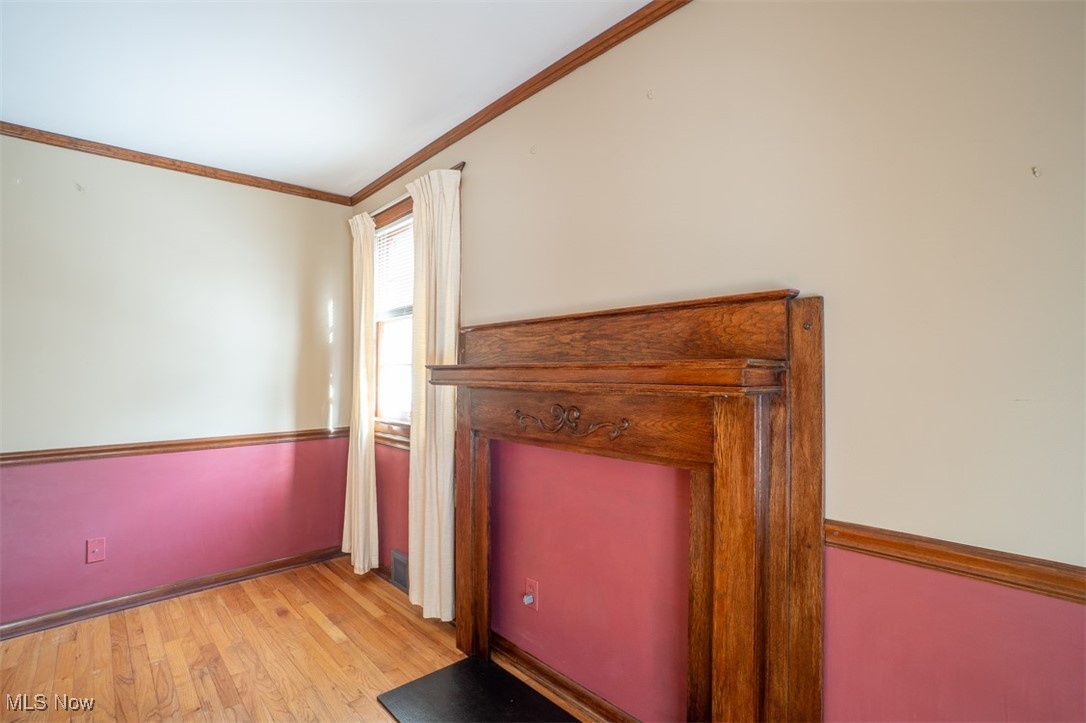 3609 Brinkmore Road Cleveland, OH 44121 - Photo 24 of 50 bedroom with light hardwood floors and ornamental molding