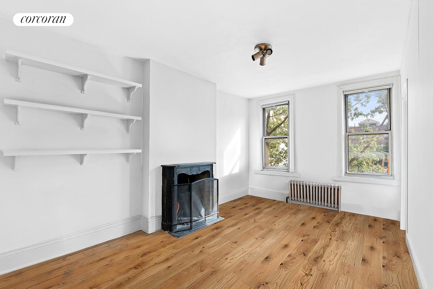 459 Union Street Brooklyn, NY 11231 - Photo 7 of 13 a view of empty room with wooden floor and fan
