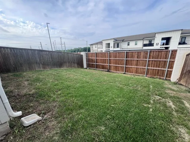 a view of a backyard with a small cabin