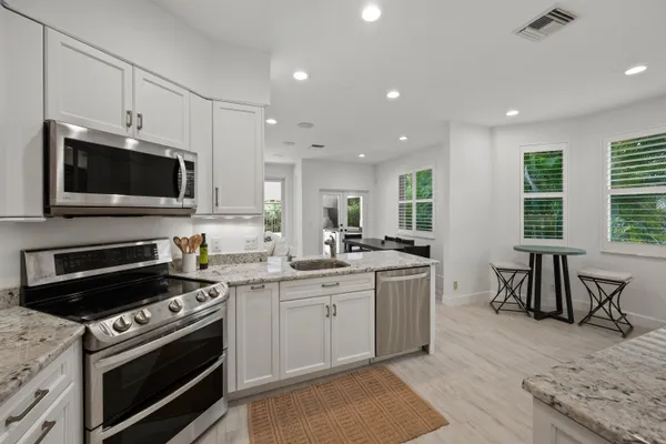 a kitchen with a stove and a microwave