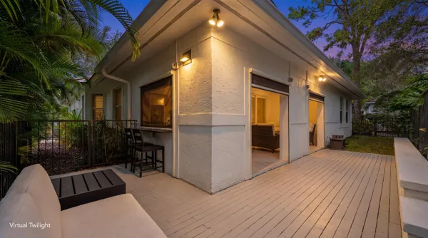 a view of backyard with tub and outdoor seating