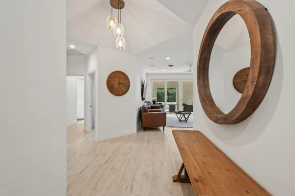 a view of a livingroom with furniture and a large window