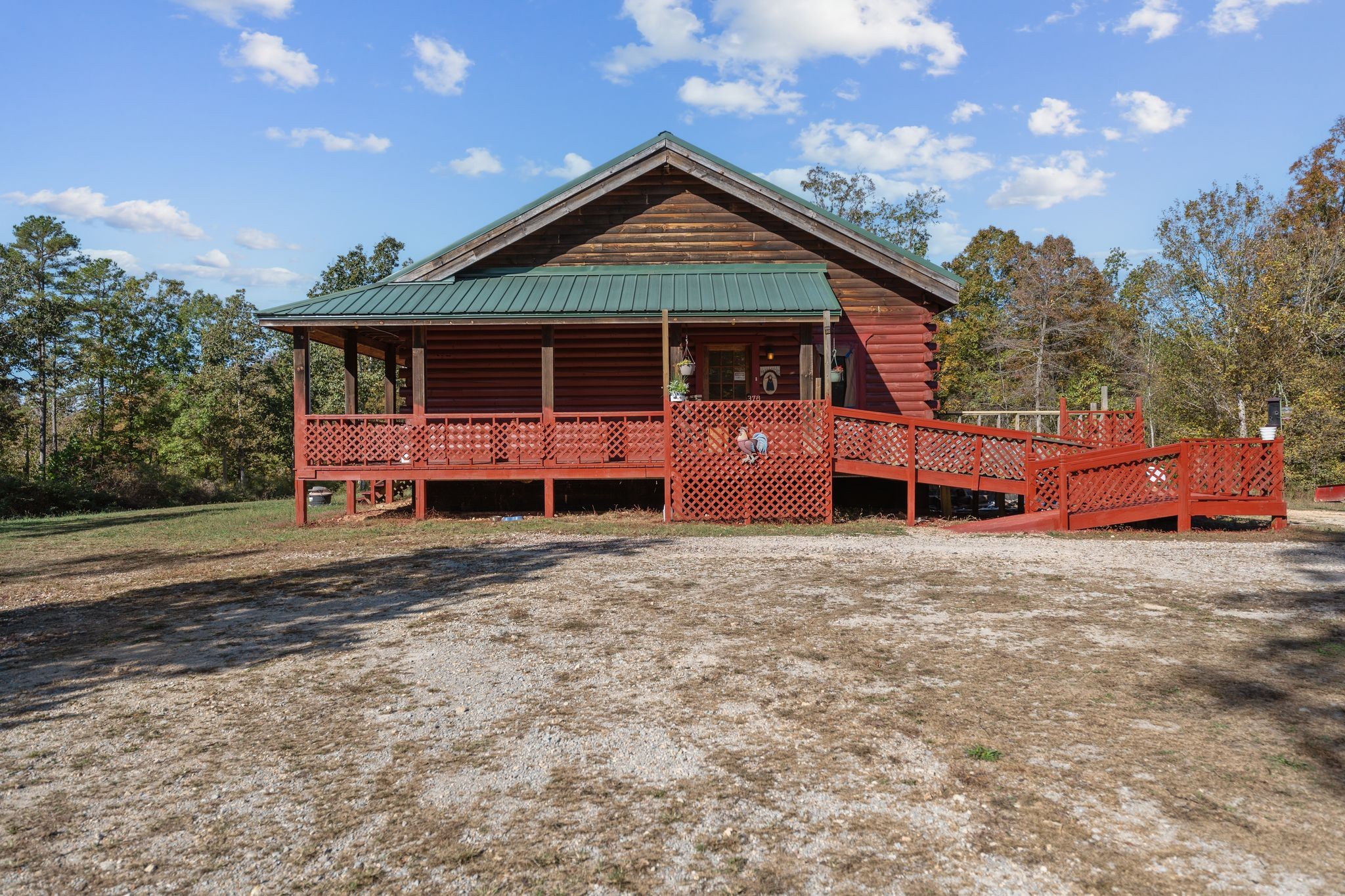 302 Faith Way Waynesboro, TN 38485 - Photo 2 of 99 a front view of a house with a yard