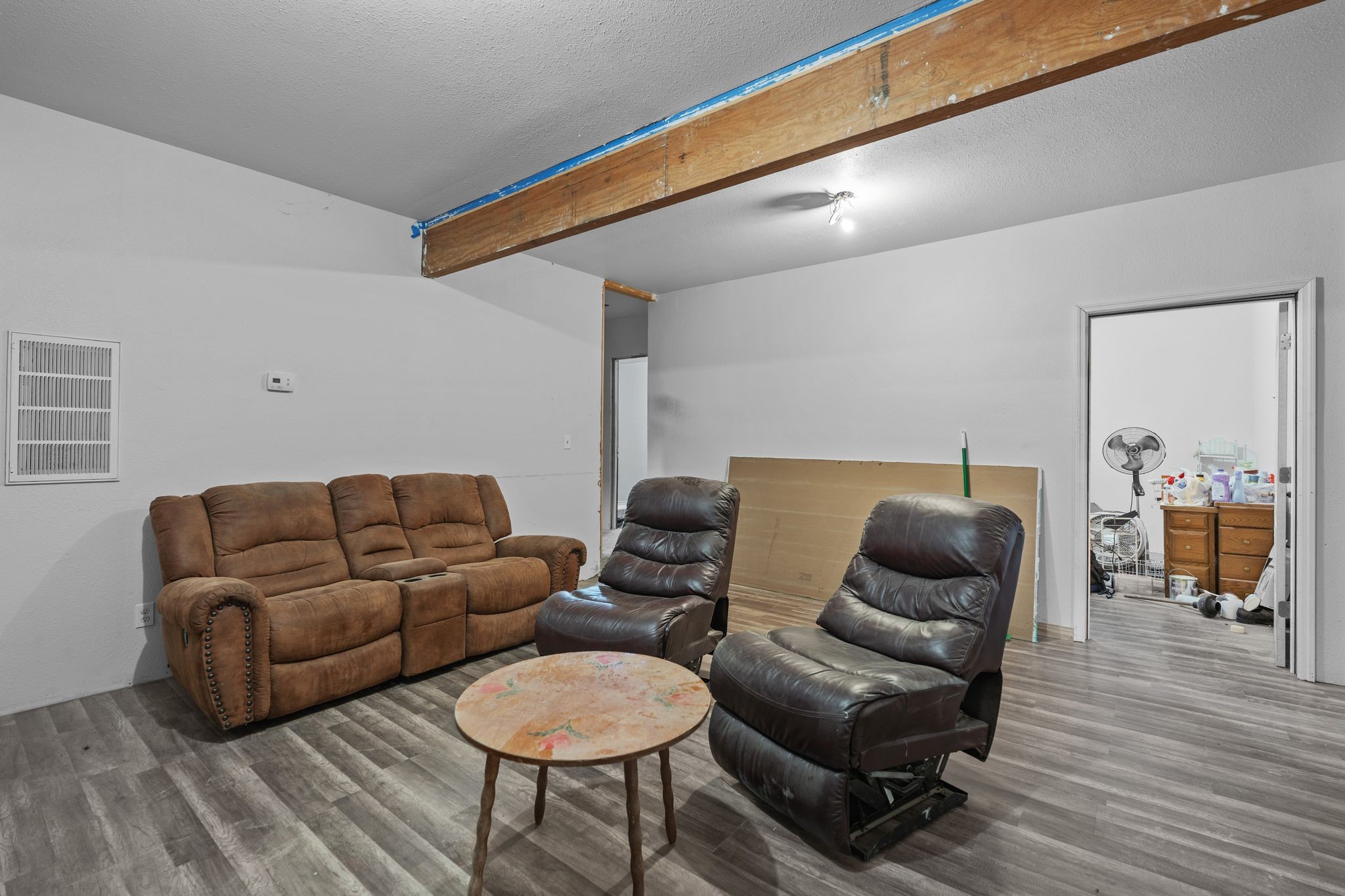 302 Faith Way Waynesboro, TN 38485 - Photo 30 of 99 a living room with furniture a flat screen tv and a wooden floor