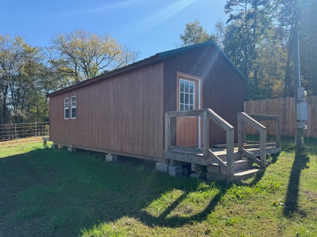 302 Faith Way Waynesboro, TN 38485 - Photo 69 of 99 a view of a backyard with plants and a patio