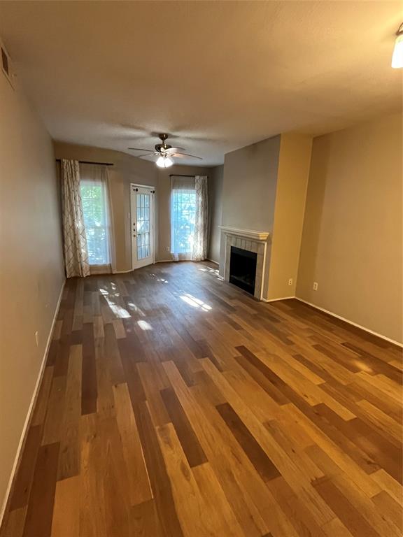 2524 Preston Road, Unit 404 Plano, TX 75093 - Photo 5 of 9 a view of an empty room with window and fire place
