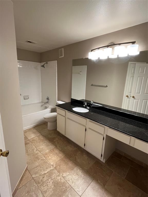 2524 Preston Road, Unit 404 Plano, TX 75093 - Photo 7 of 9 a large white kitchen with a sink and dishwasher a stove with wooden floor