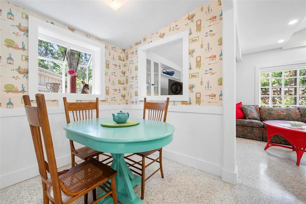 528 45th Street Sarasota, FL 34234 - Photo 11 of 45 a view of a dining room with furniture and a potted plant