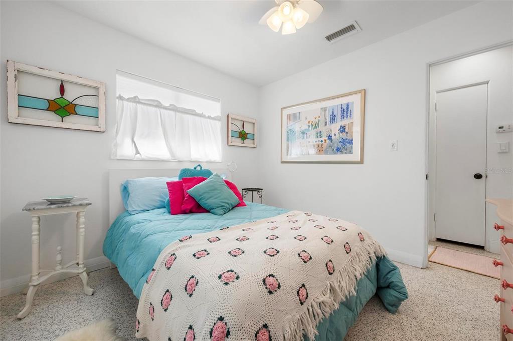 528 45th Street Sarasota, FL 34234 - Photo 21 of 45 a bedroom with a bed and a painting on the wall