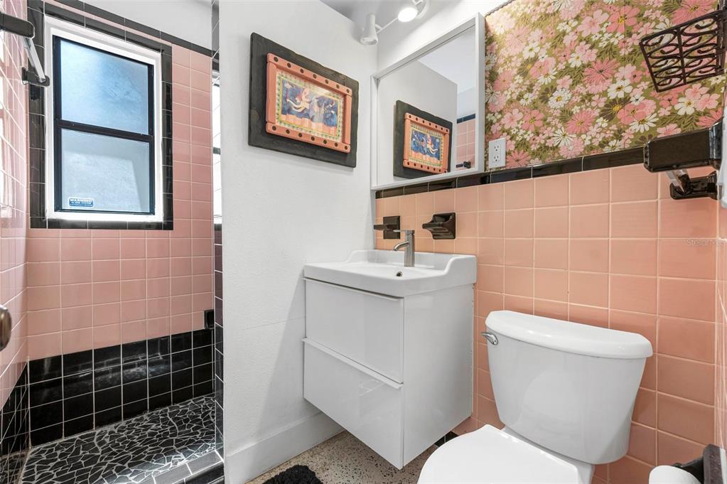 528 45th Street Sarasota, FL 34234 - Photo 22 of 45 a bathroom with a toilet a sink and a shower